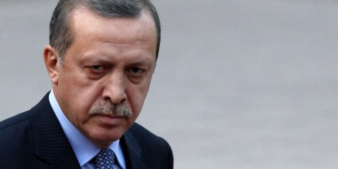 Turkey's Prime Minister Tayyip Erdogan arrives at his office in Ankara